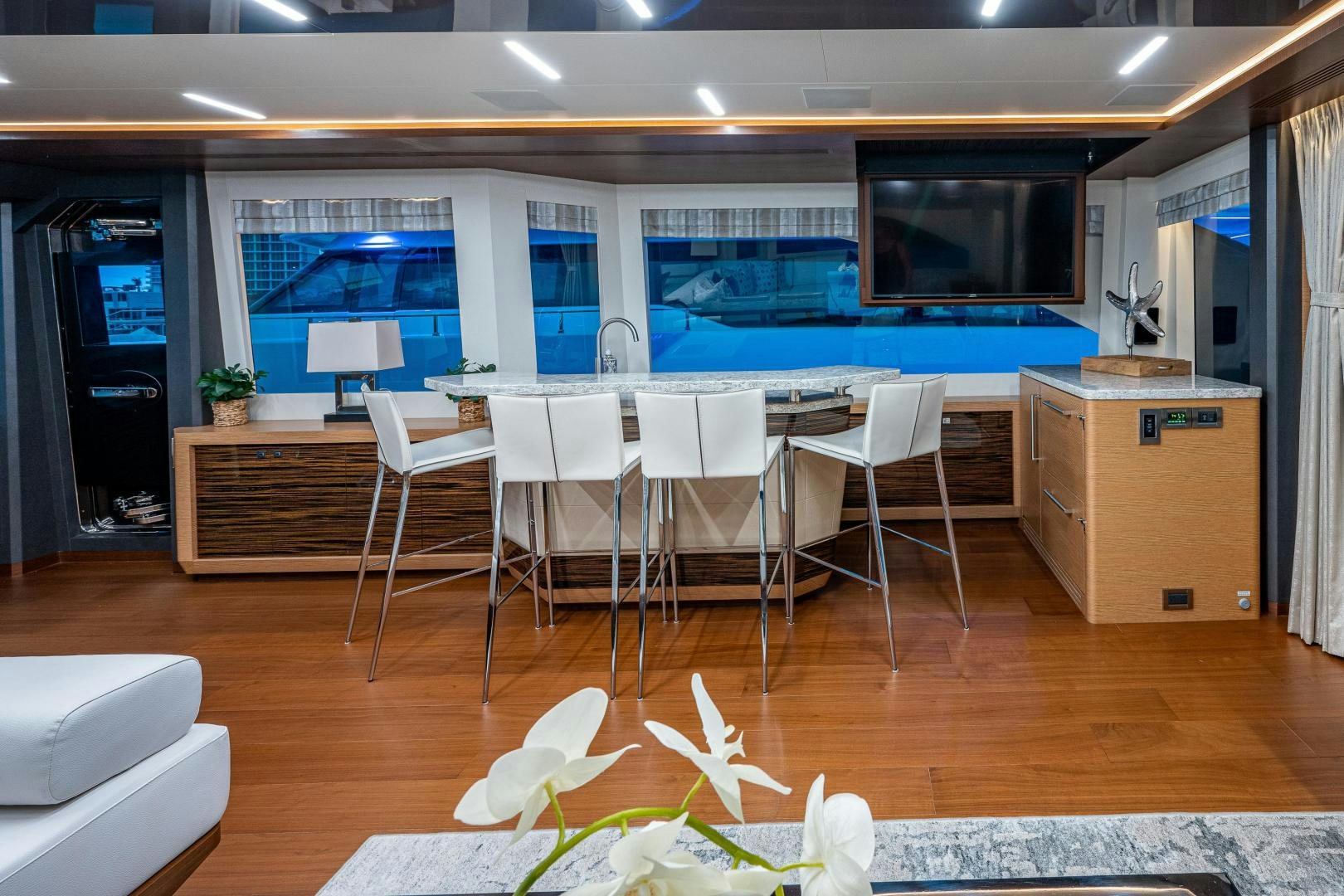 a room with a table and chairs aboard SEAMENT Yacht for Sale