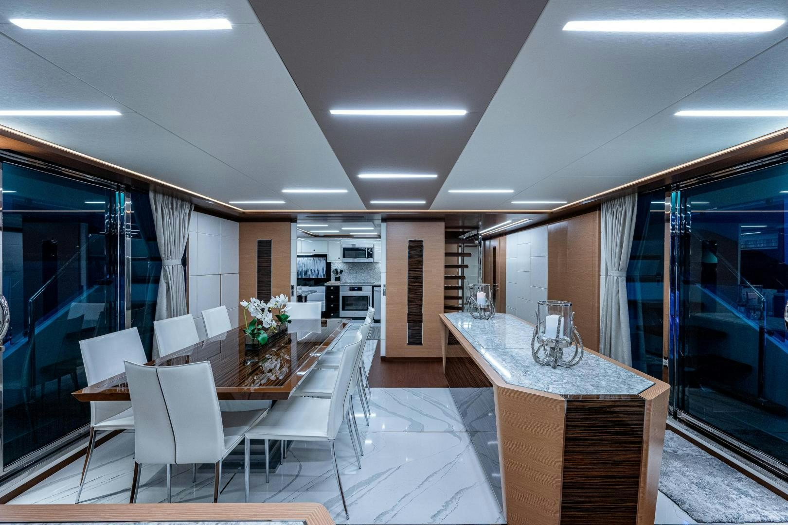 a large room with a table and chairs aboard SEAMENT Yacht for Sale