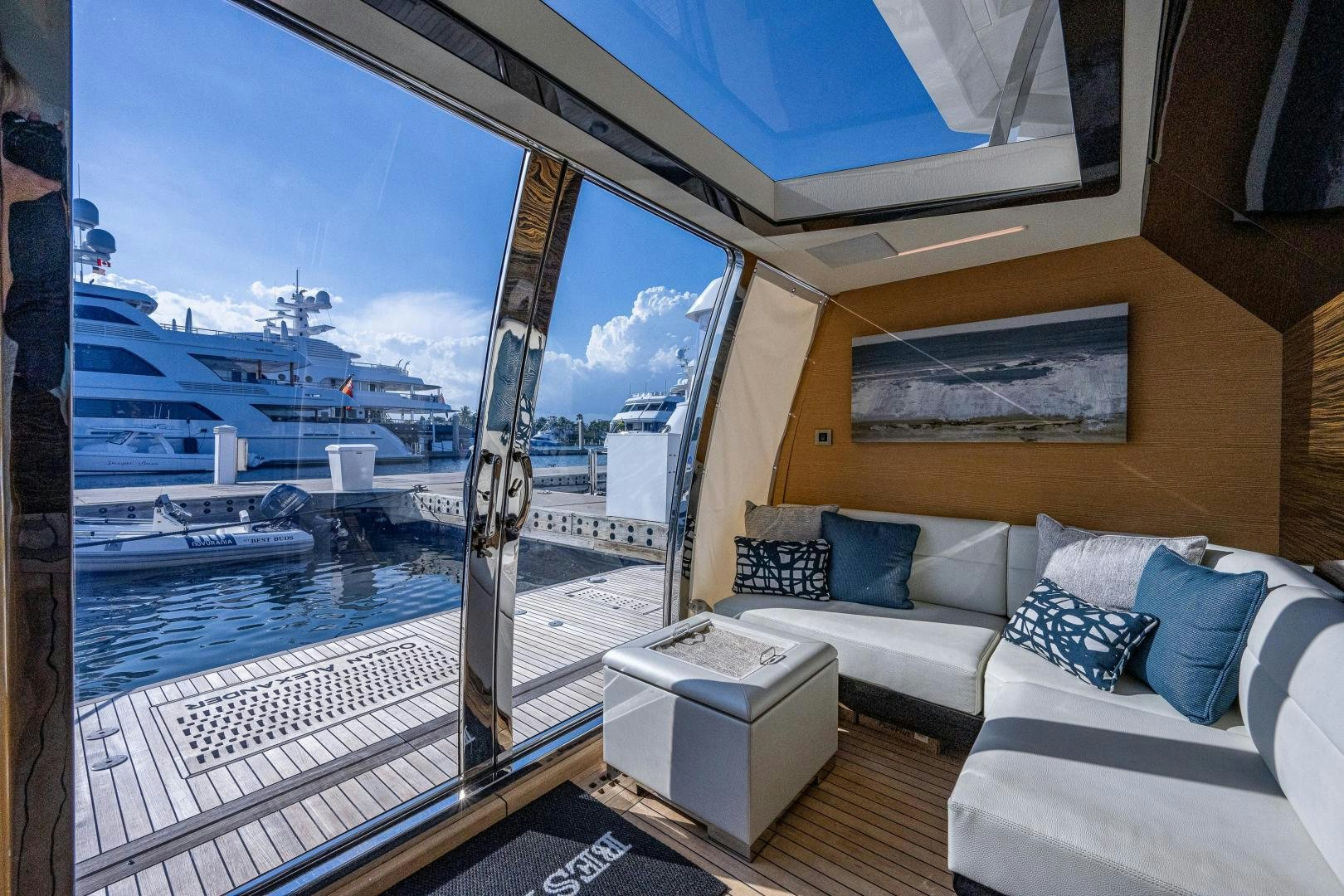 a room with a couch and a view of the water aboard SEAMENT Yacht for Sale
