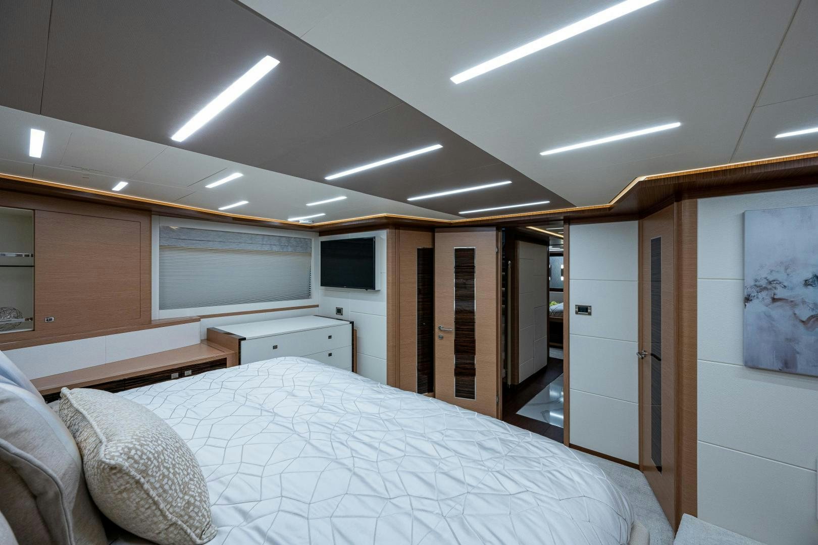 a room with a bed and cabinets aboard SEAMENT Yacht for Sale