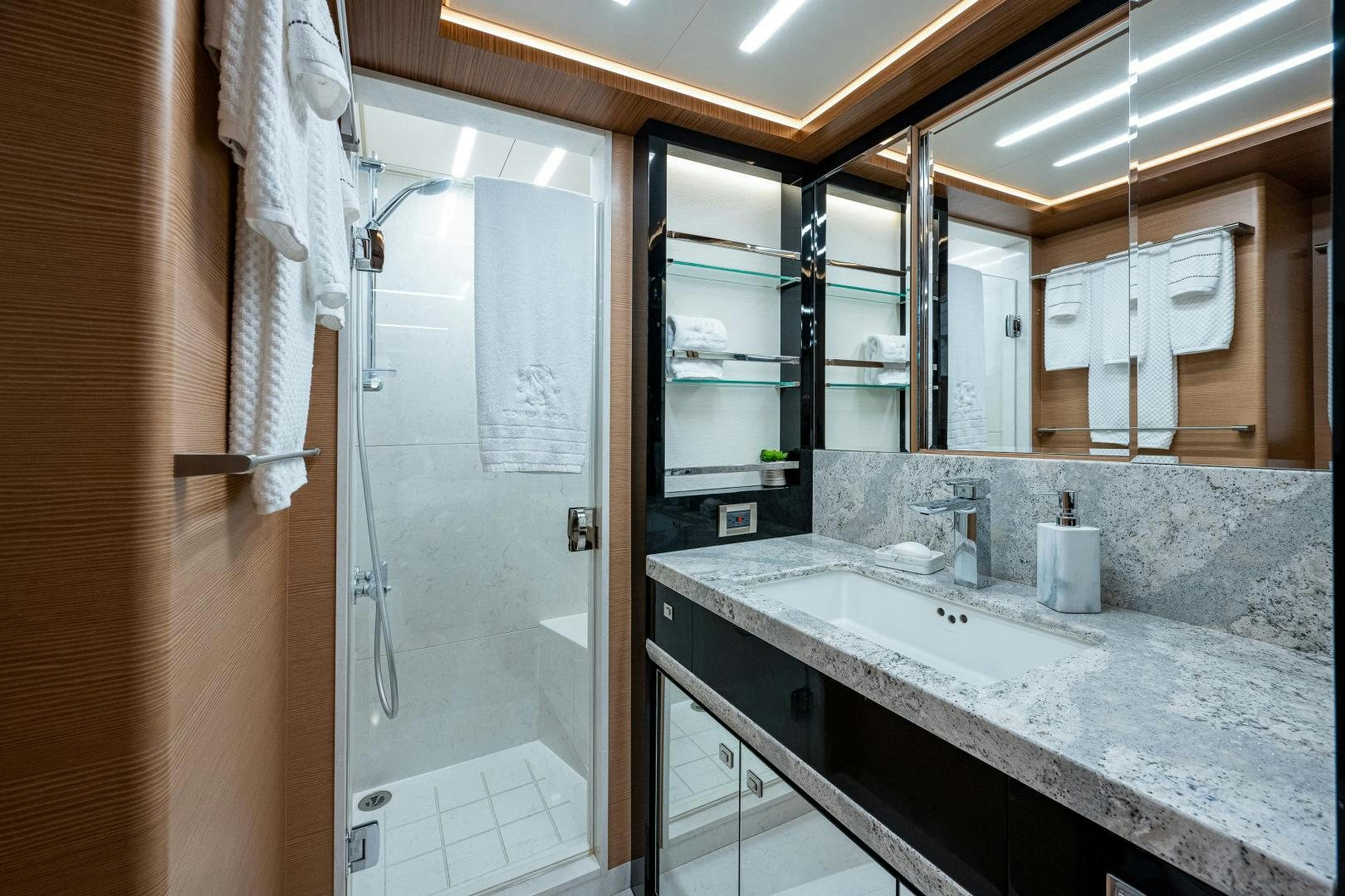 a bathroom with a shower and sink aboard SEAMENT Yacht for Sale