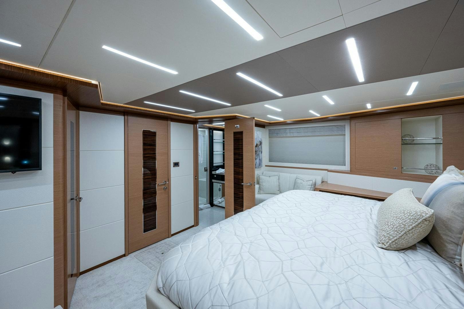 a room with a bed and a television aboard SEAMENT Yacht for Sale