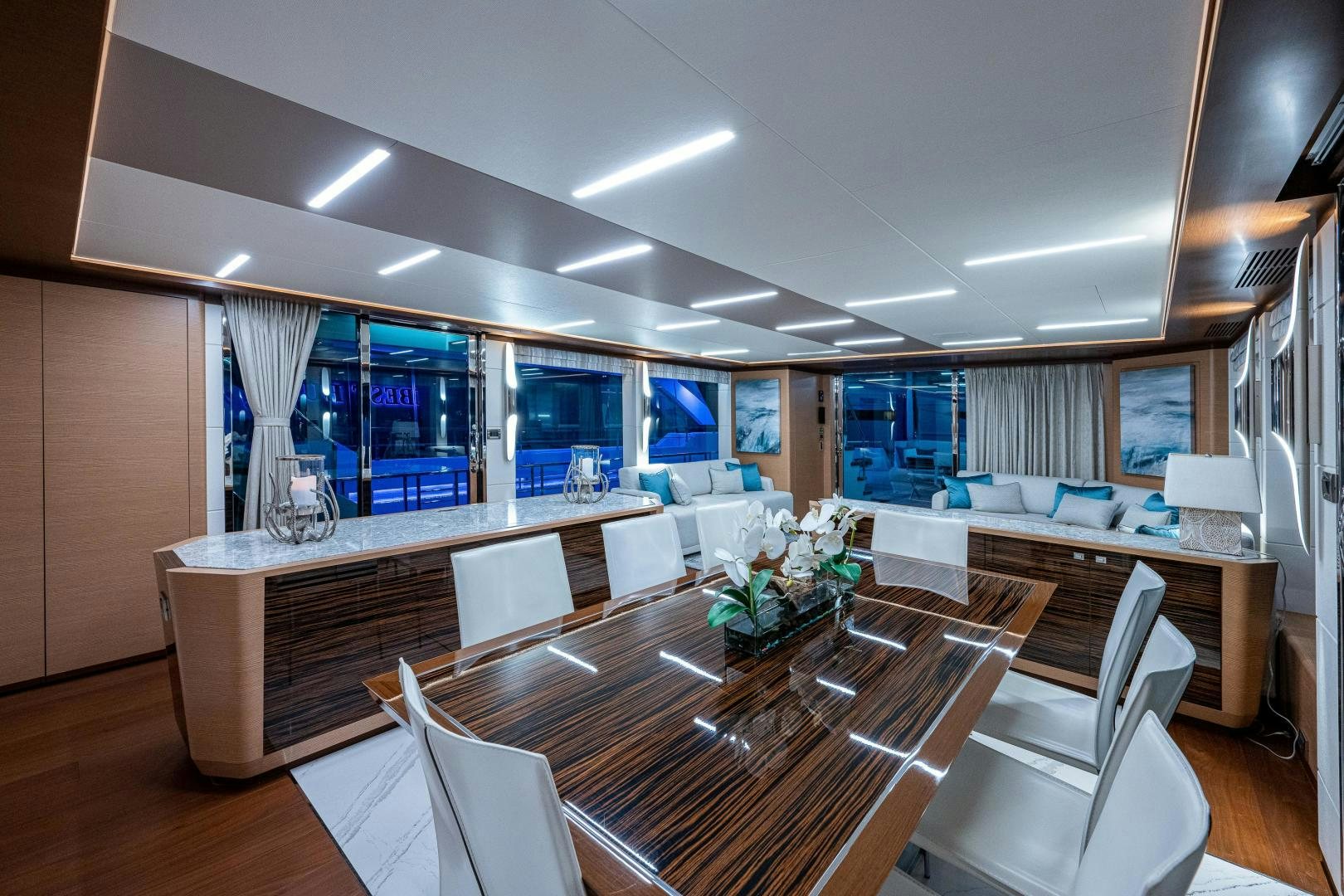 a large room with a table and chairs aboard SEAMENT Yacht for Sale