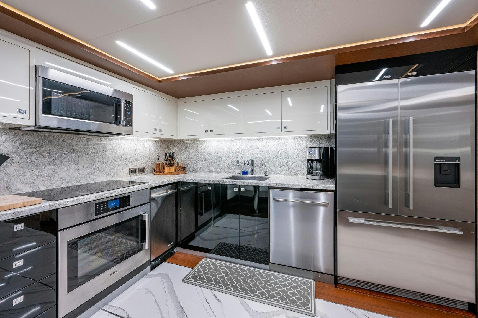 a kitchen with stainless steel appliances aboard SEAMENT Yacht for Sale