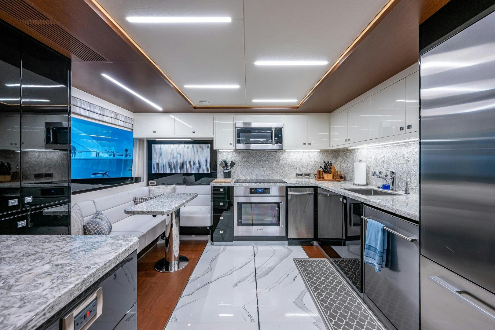 a kitchen with a large island aboard SEAMENT Yacht for Sale