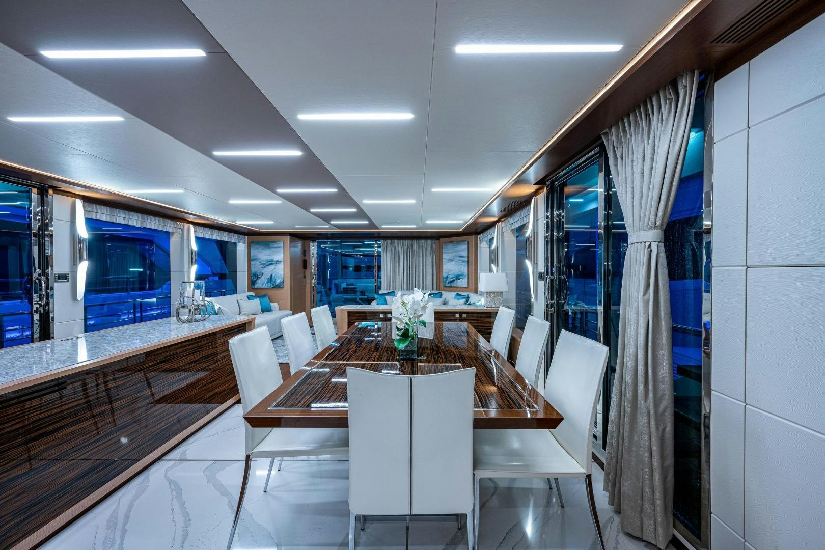 a room with a table and chairs aboard SEAMENT Yacht for Sale