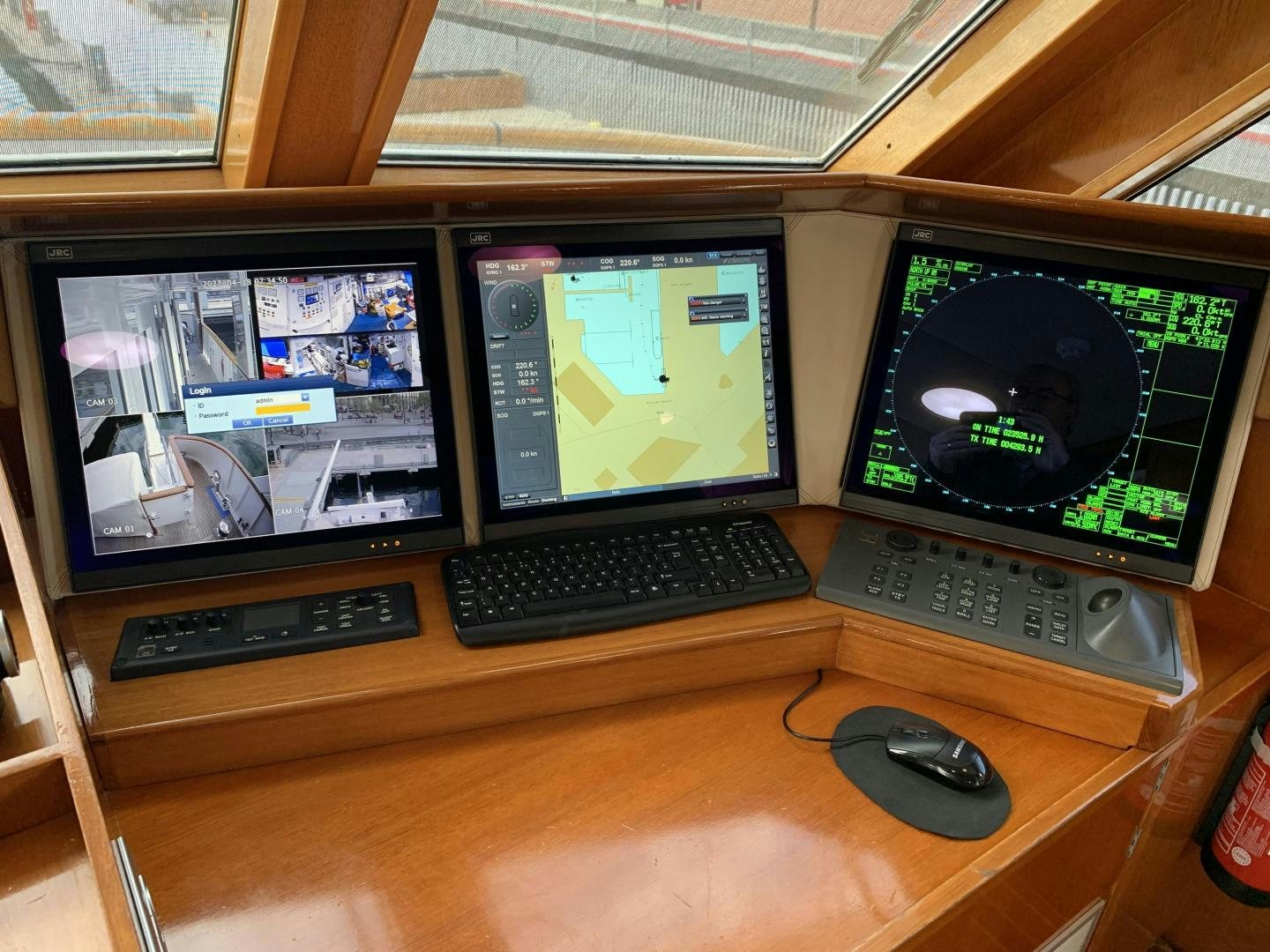 a desk with computer monitors and keyboards aboard MONACO Yacht for Sale