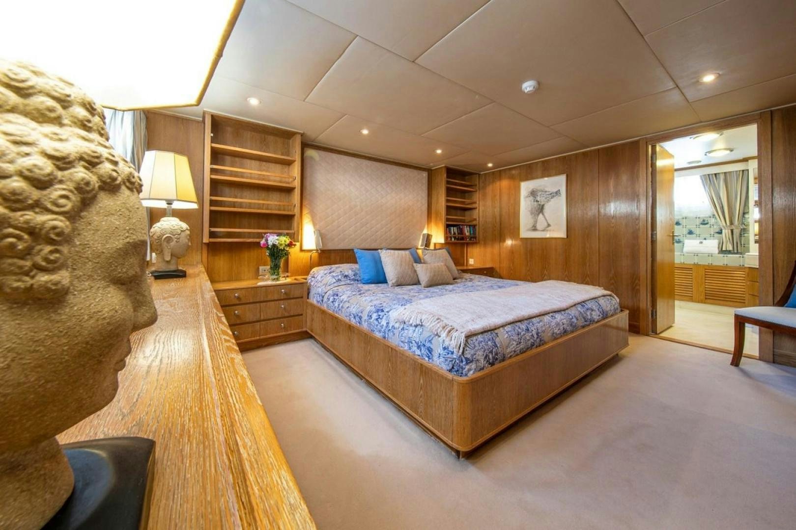 a bedroom with a large bed aboard MONACO Yacht for Sale