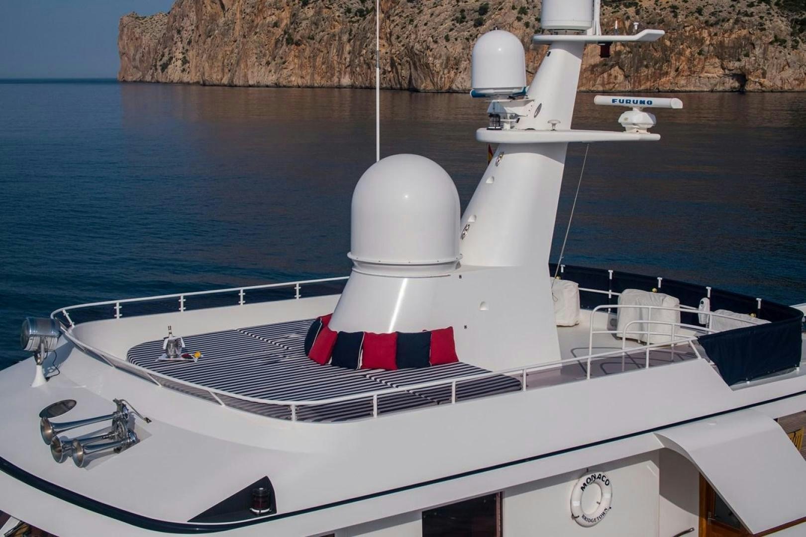 a boat with a red and white stripe on the front aboard MONACO Yacht for Sale