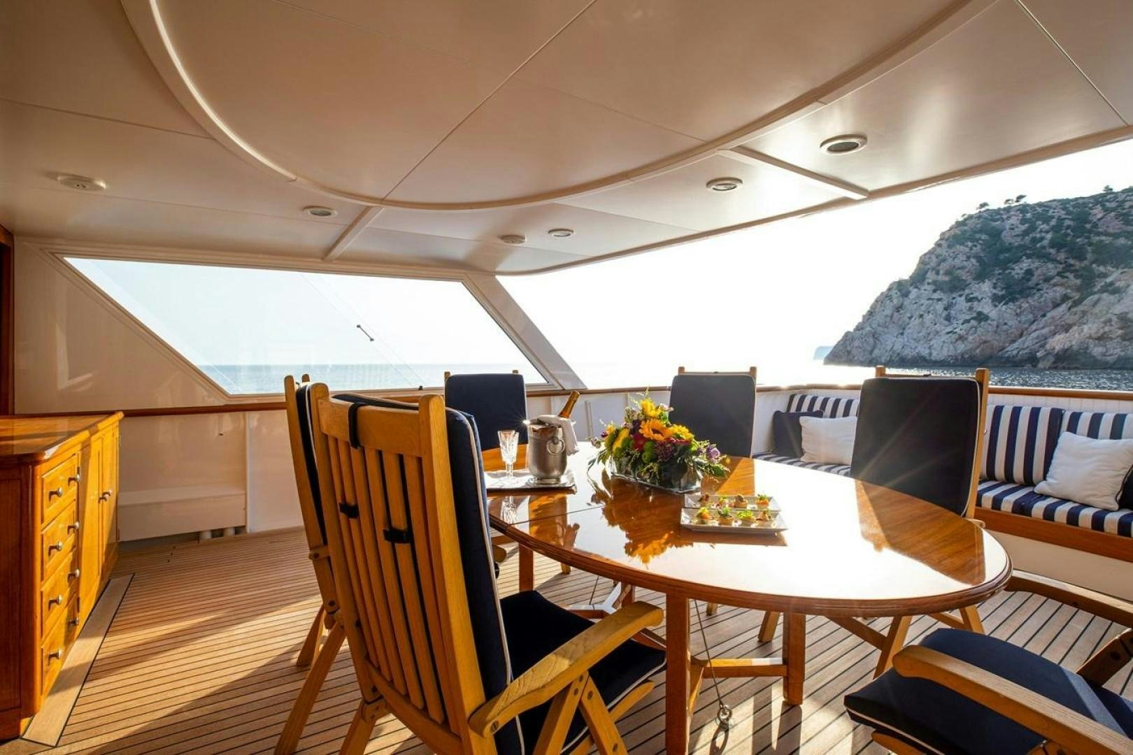a dining table on a boat aboard MONACO Yacht for Sale