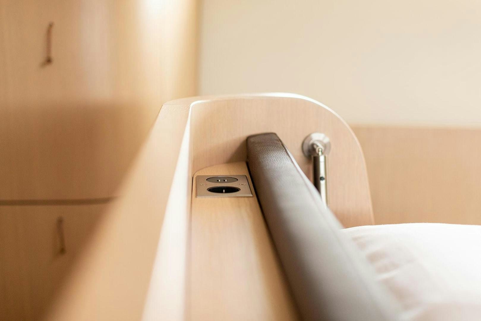 a close-up of a hand holding a phone aboard CIN CIN Yacht for Sale
