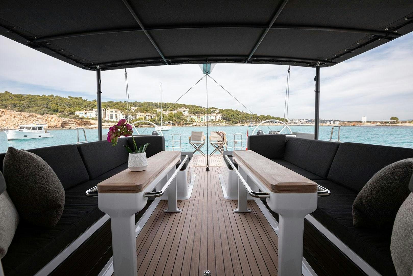 a deck with chairs and tables aboard CIN CIN Yacht for Sale