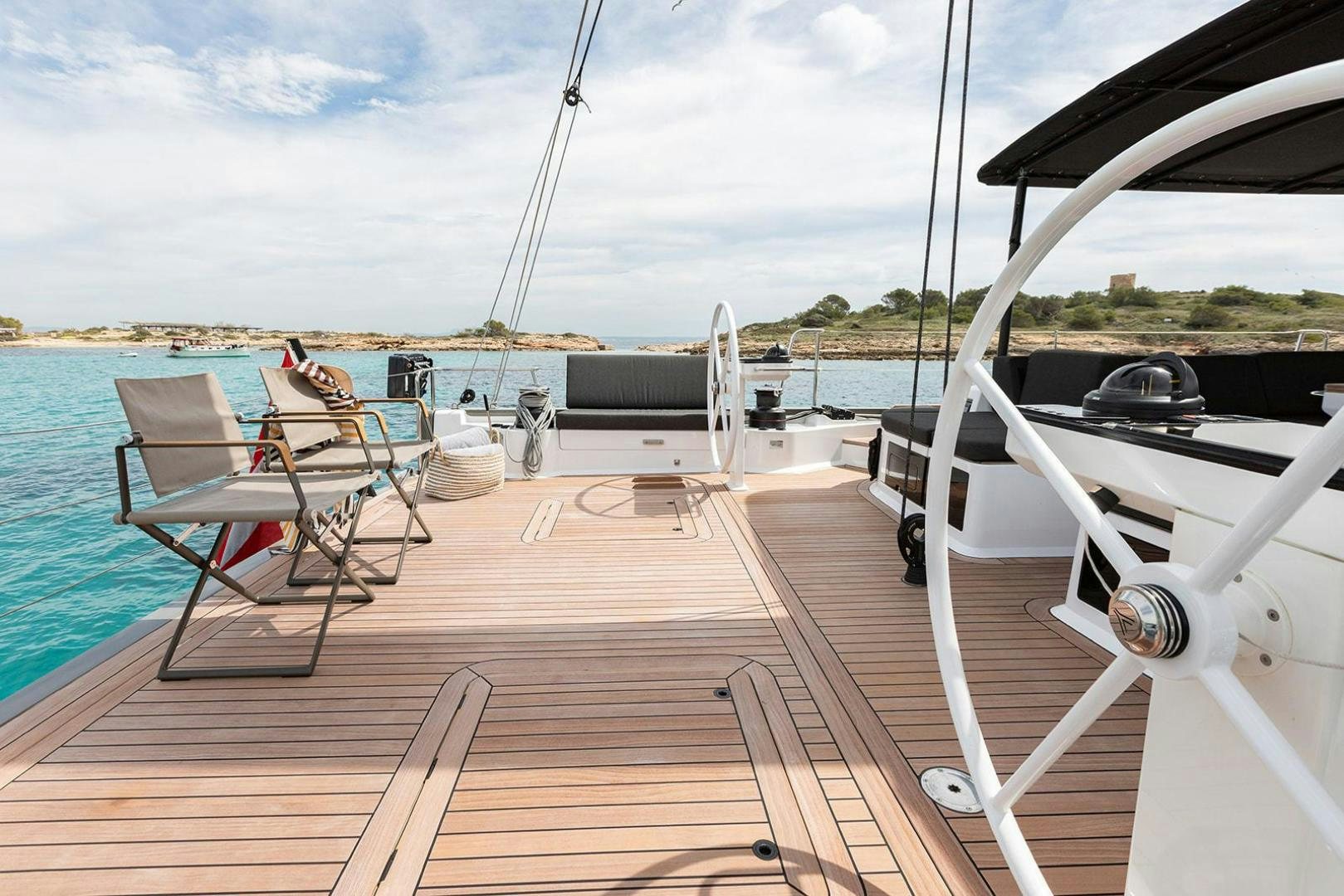 a deck with chairs on it aboard CIN CIN Yacht for Sale