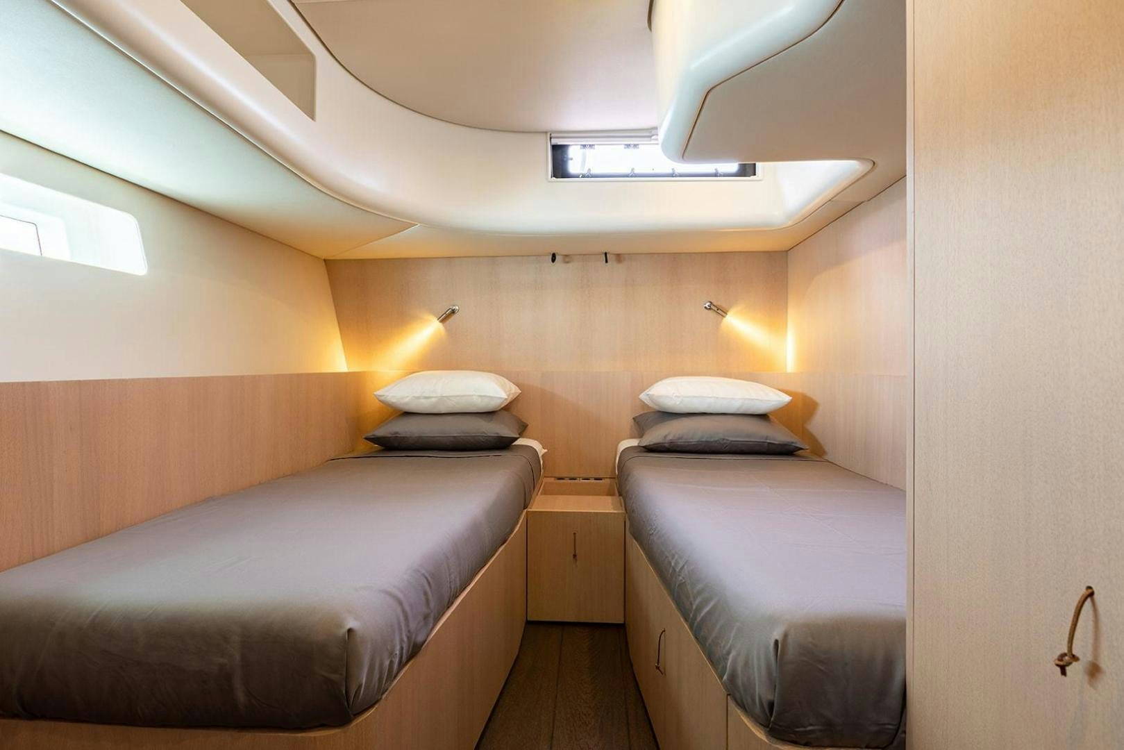 a couple of beds in a room aboard CIN CIN Yacht for Sale