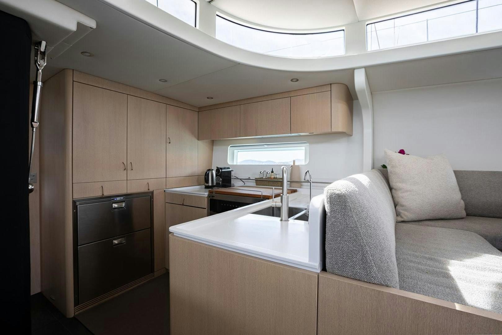 a room with a couch and a television aboard CIN CIN Yacht for Sale
