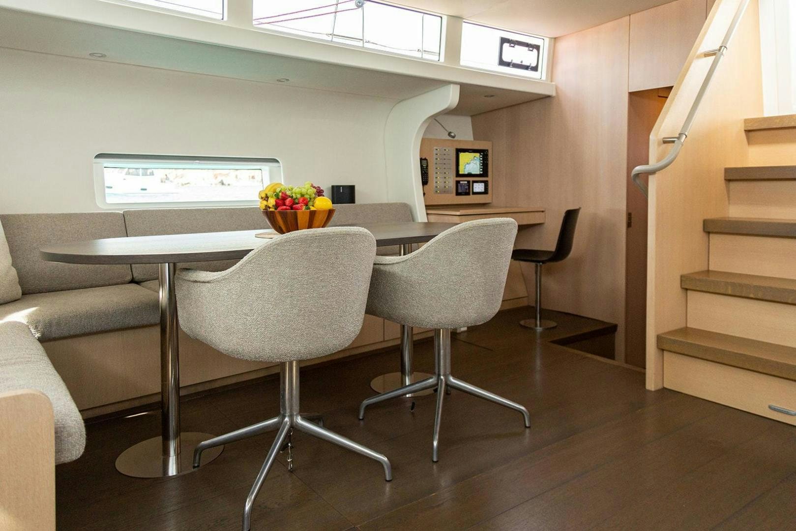 a table and chairs in a room aboard CIN CIN Yacht for Sale