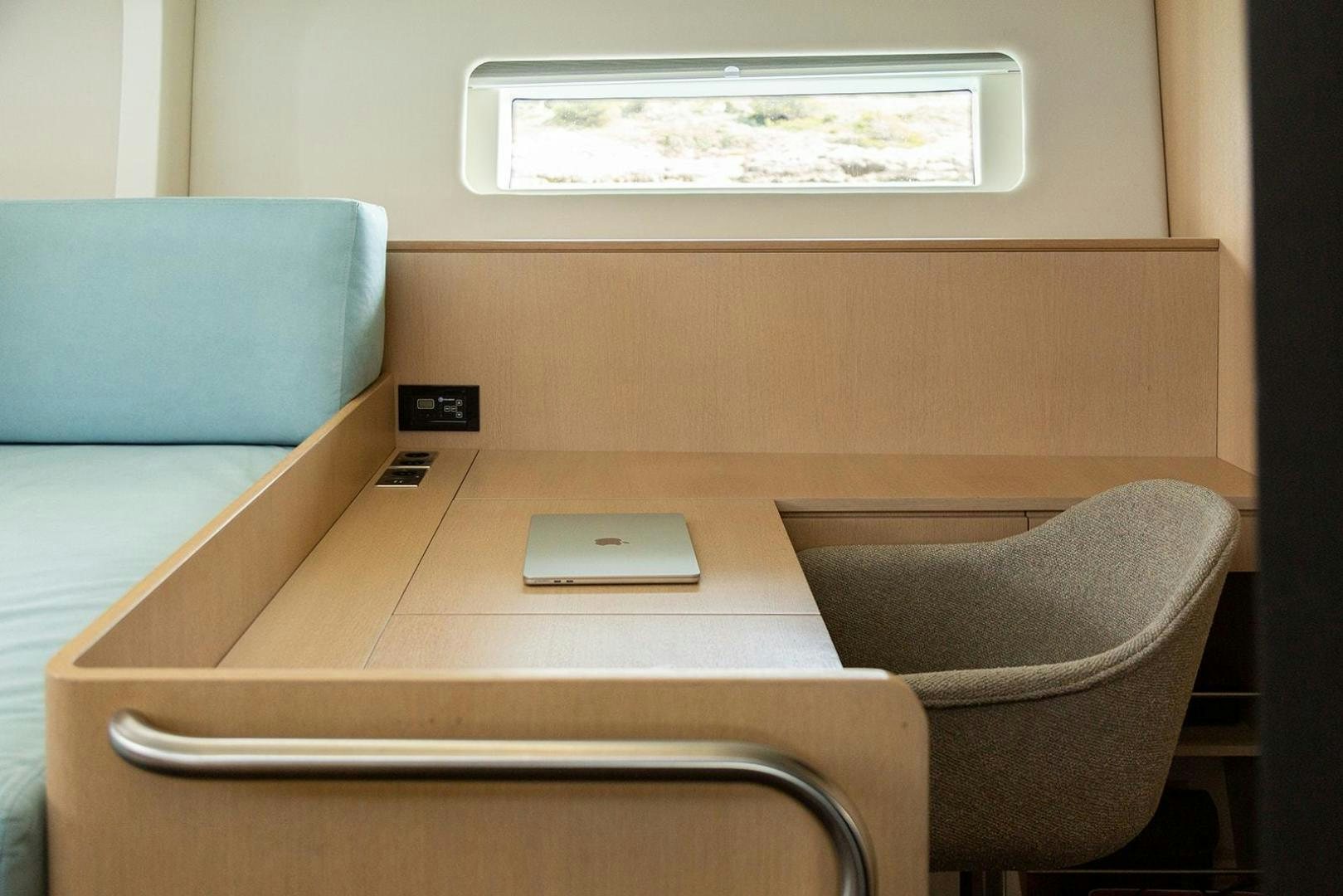 a laptop on a table aboard CIN CIN Yacht for Sale