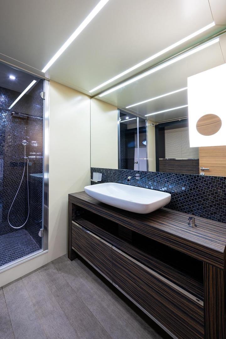 a bathroom with a large mirror aboard IMAGINE Yacht for Sale