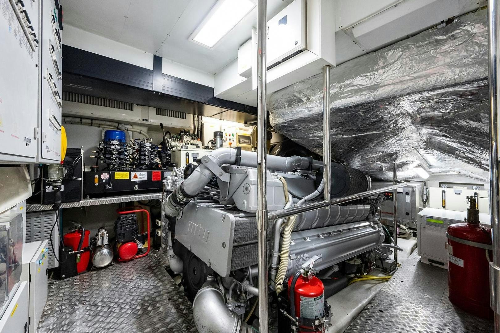 a room with machinery and pipes aboard IMAGINE Yacht for Sale