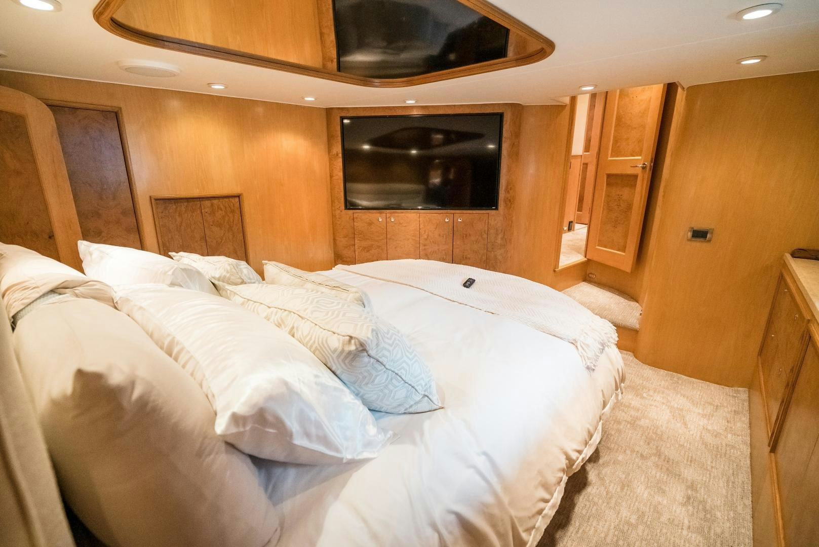 a room with a bed and a television aboard CAPITAN MORGAN  Yacht for Sale