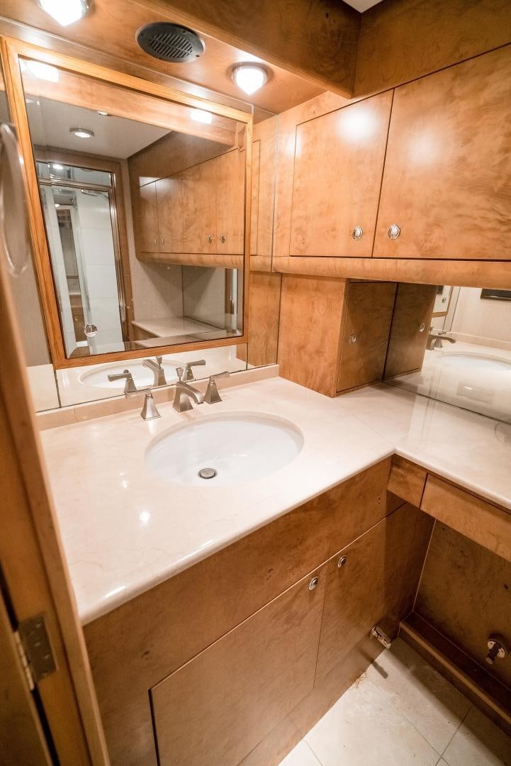 a bathroom with a large mirror aboard CAPITAN MORGAN  Yacht for Sale