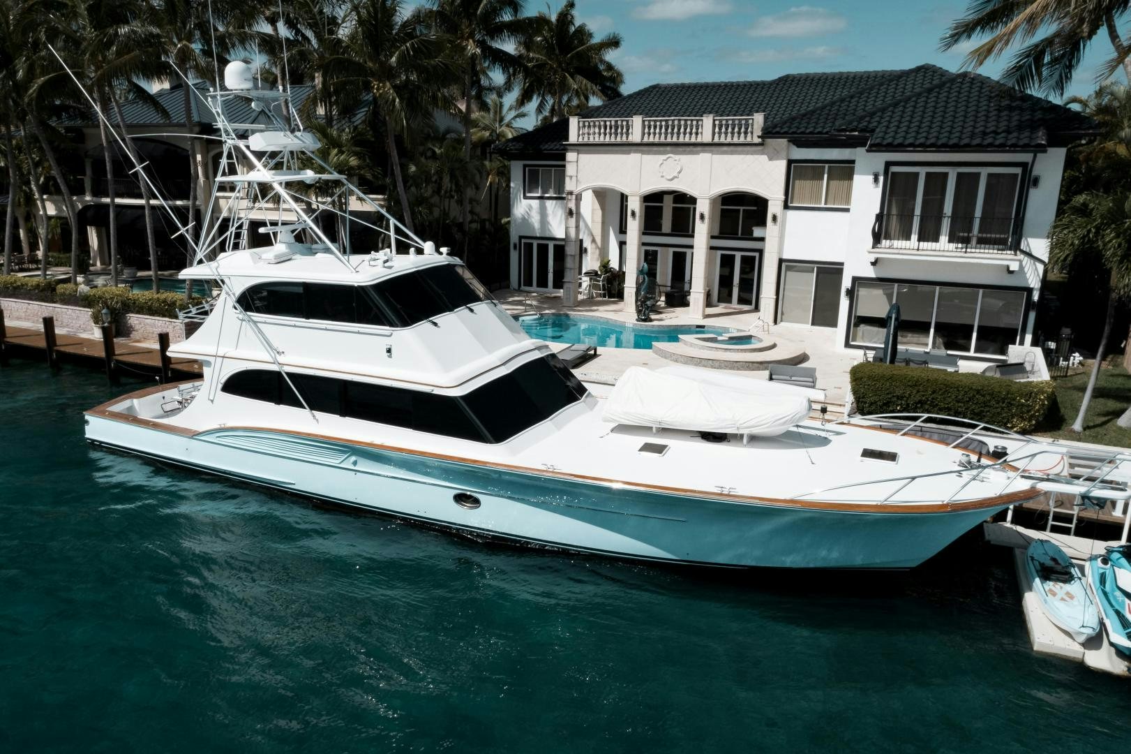 a large white boat in a tropical area aboard CAPITAN MORGAN  Yacht for Sale