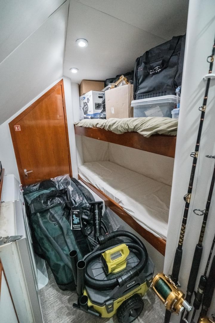 a room with a bed and a luggage aboard CAPITAN MORGAN  Yacht for Sale