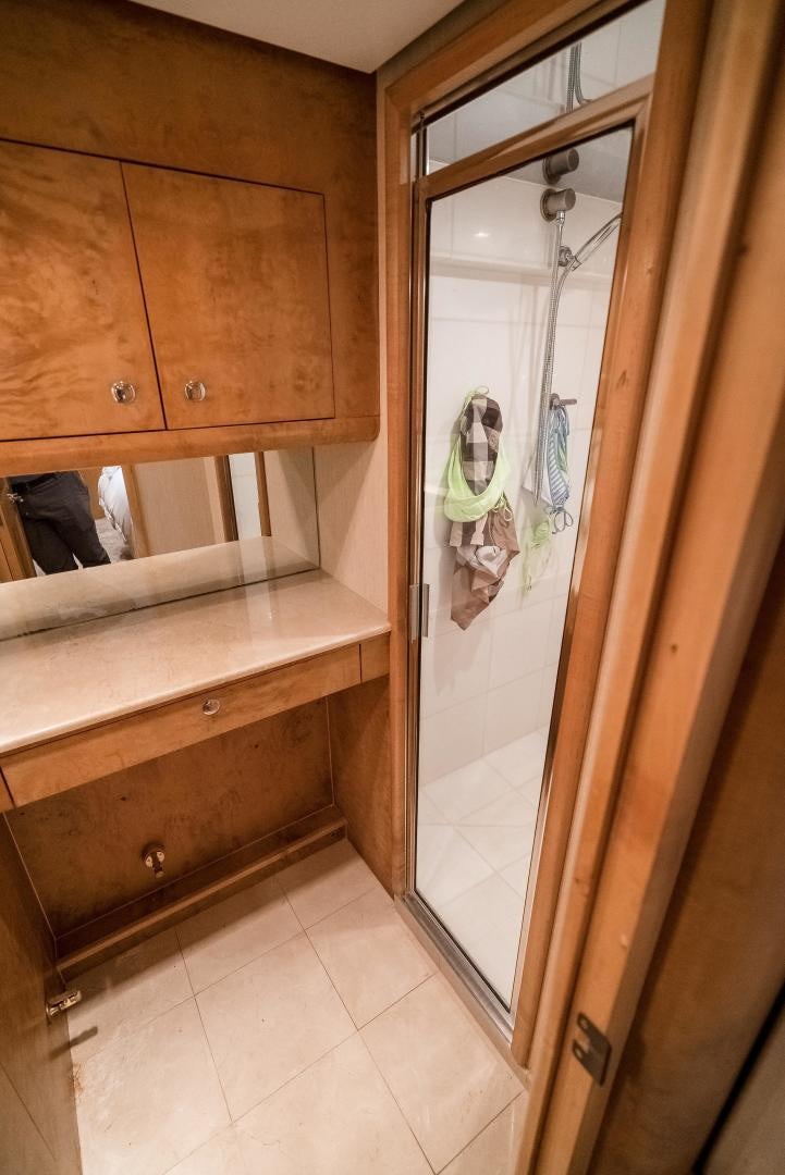 a bathroom with a mirror and a shower aboard CAPITAN MORGAN  Yacht for Sale