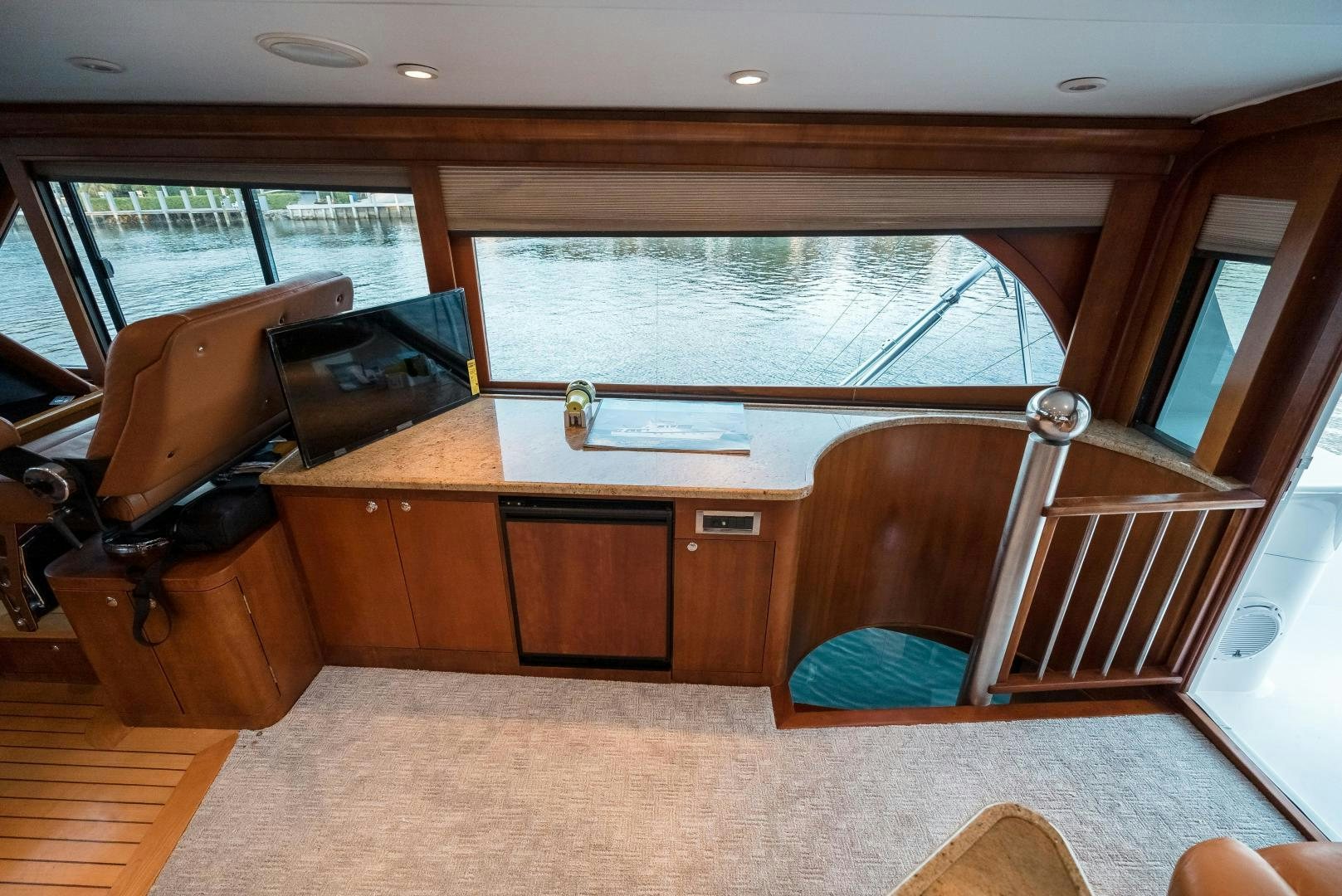 a room with a couch and a table and a chair aboard CAPITAN MORGAN  Yacht for Sale