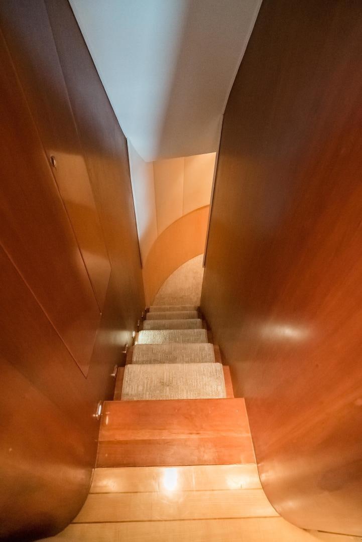a staircase with a light aboard CAPITAN MORGAN  Yacht for Sale