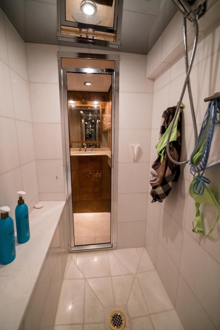 a bathroom with a glass shower aboard CAPITAN MORGAN  Yacht for Sale
