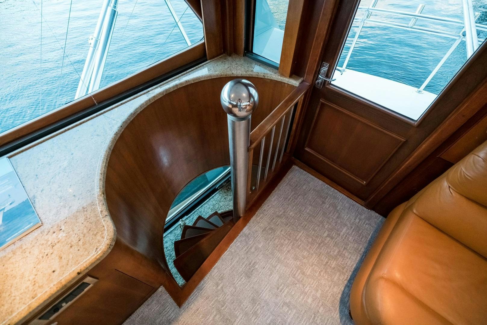 a spiral staircase in a house aboard CAPITAN MORGAN  Yacht for Sale