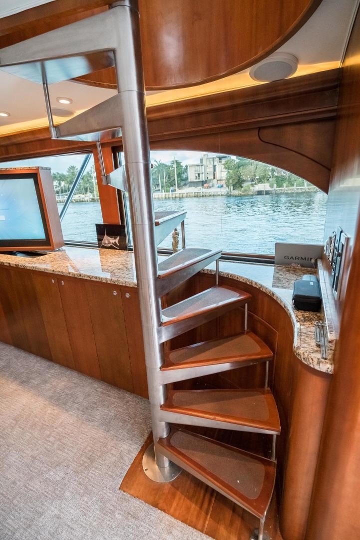 a wood chair in a room aboard CAPITAN MORGAN  Yacht for Sale