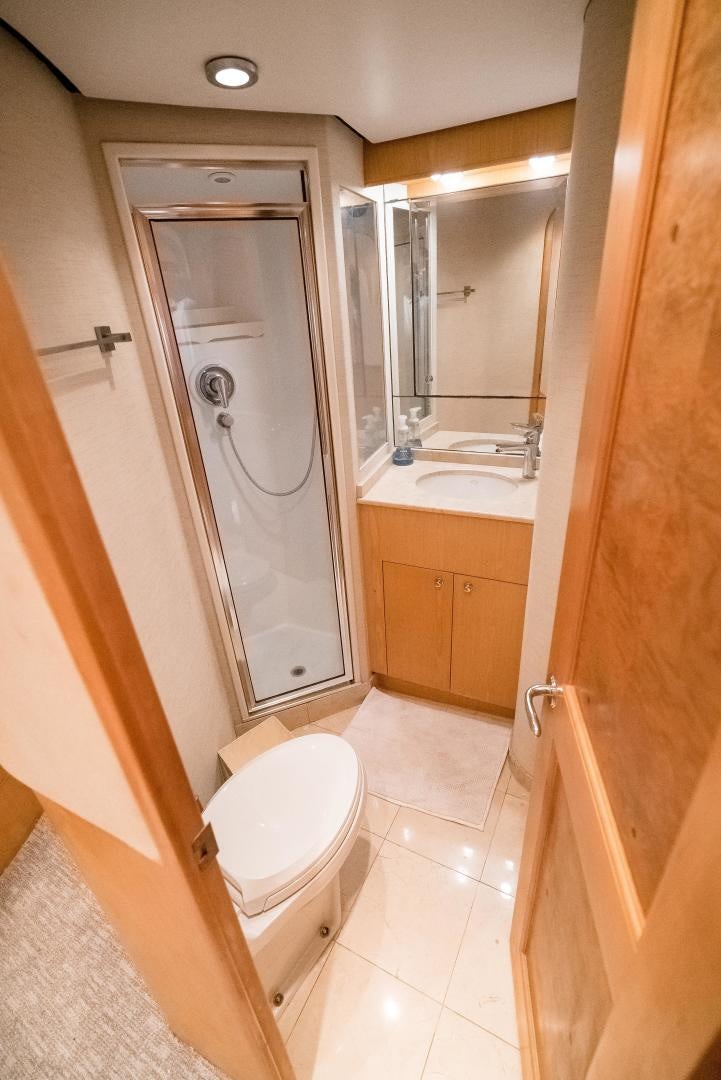 a bathroom with a shower and toilet aboard CAPITAN MORGAN  Yacht for Sale