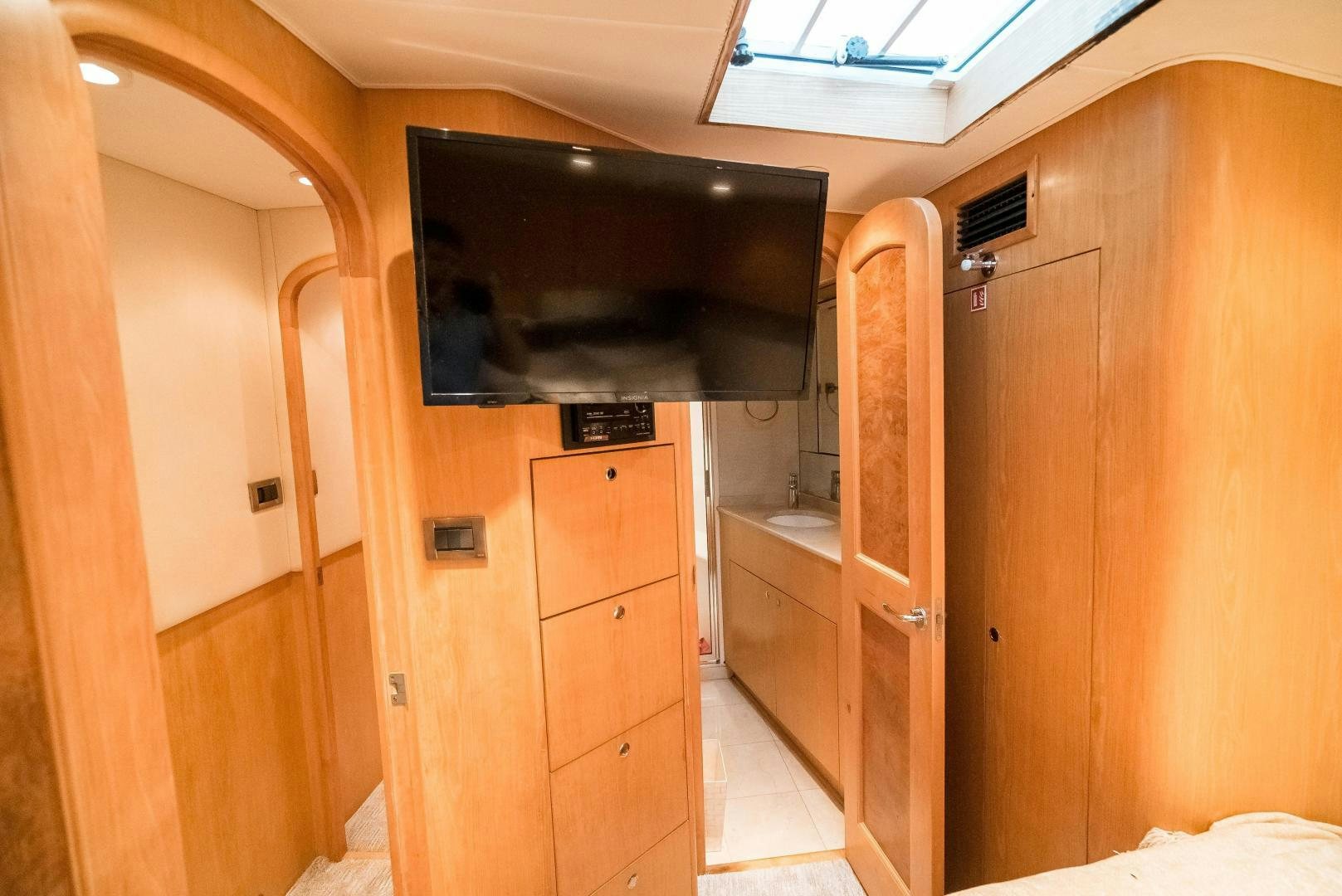 a room with wooden cabinets aboard CAPITAN MORGAN  Yacht for Sale
