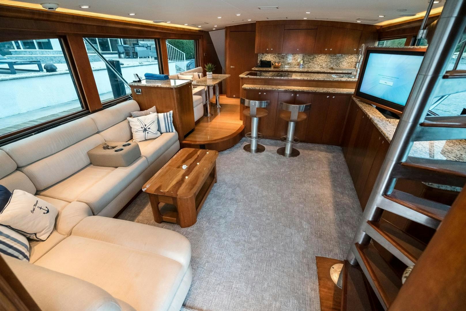 a living room with a large window aboard CAPITAN MORGAN  Yacht for Sale
