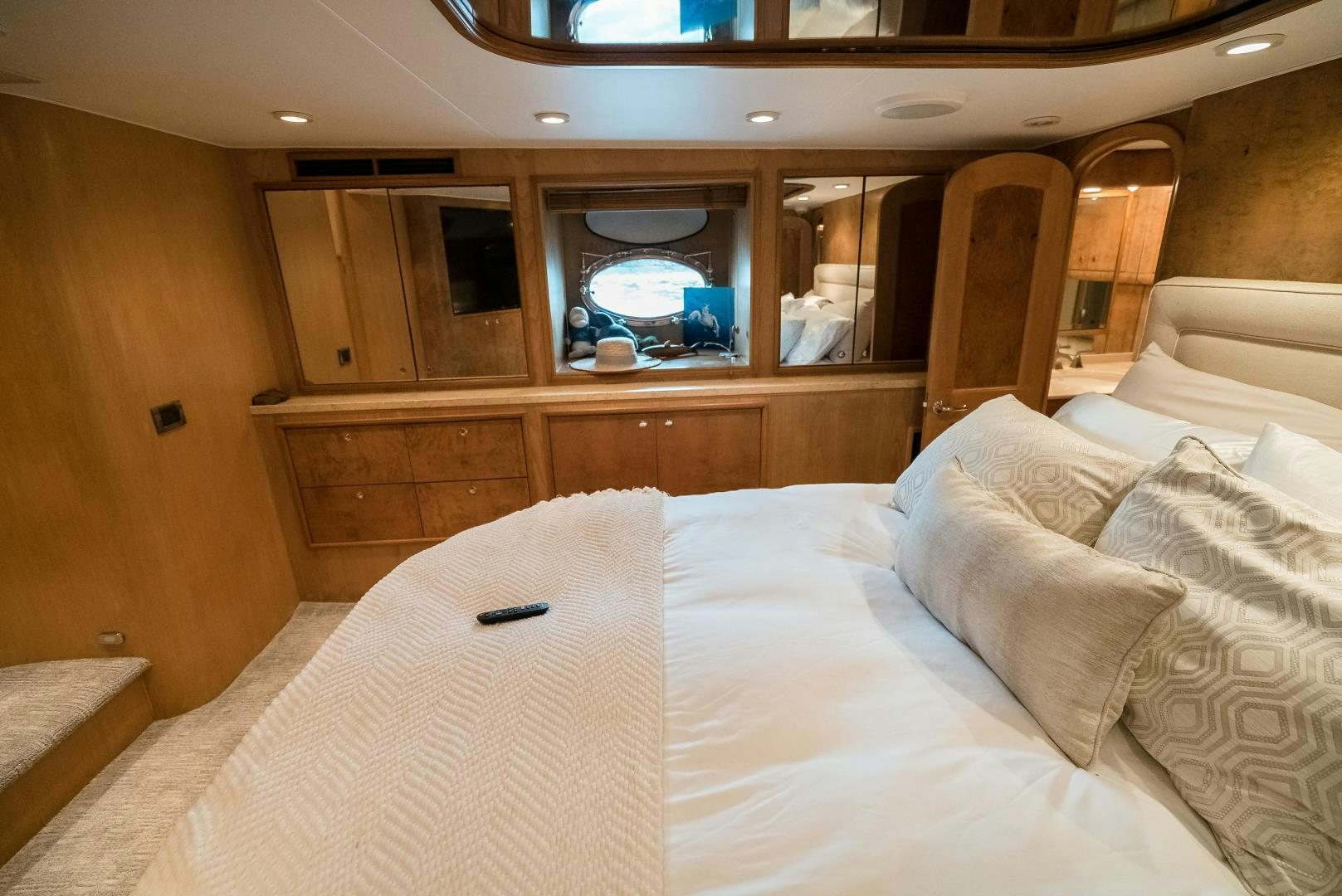 a bed with white sheets and pillows aboard CAPITAN MORGAN  Yacht for Sale