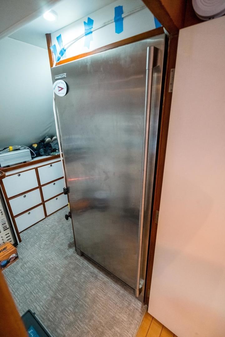 a refrigerator in a kitchen aboard CAPITAN MORGAN  Yacht for Sale