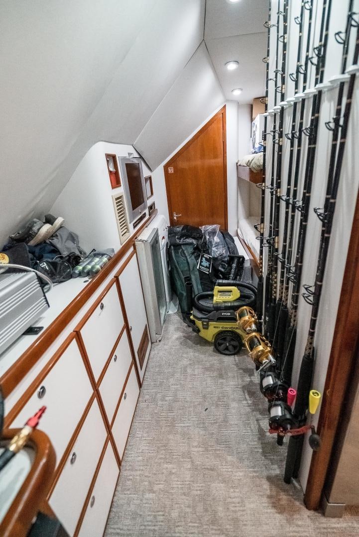 a room with a lot of clutter aboard CAPITAN MORGAN  Yacht for Sale