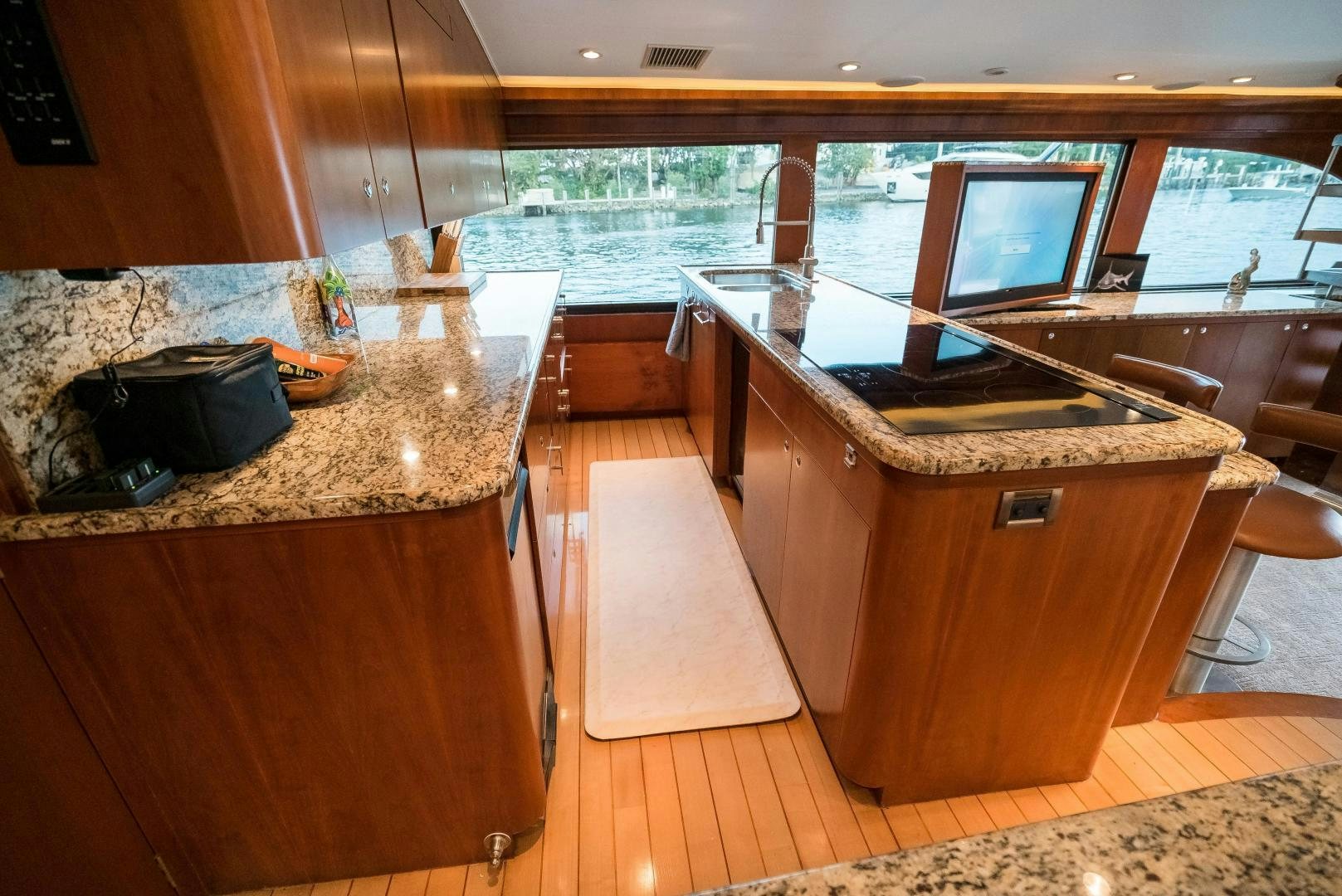 a kitchen with a large island aboard CAPITAN MORGAN  Yacht for Sale