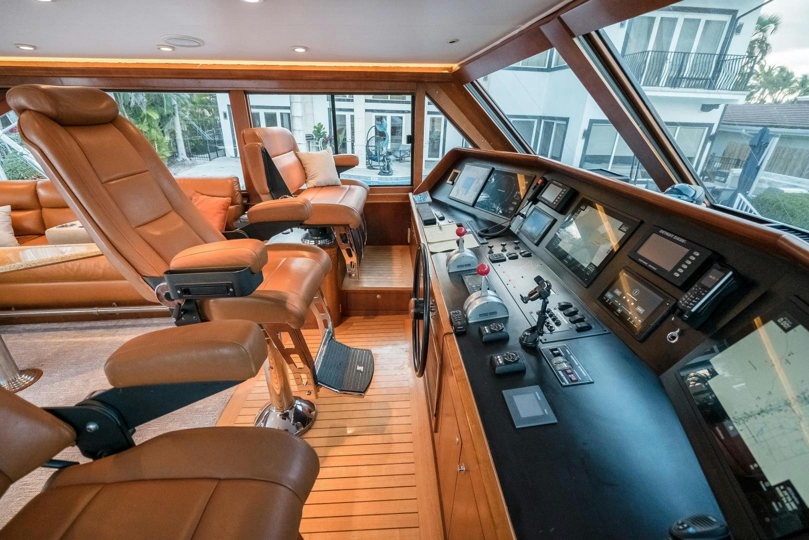 a room with a large window and a desk with computers on it aboard CAPITAN MORGAN  Yacht for Sale