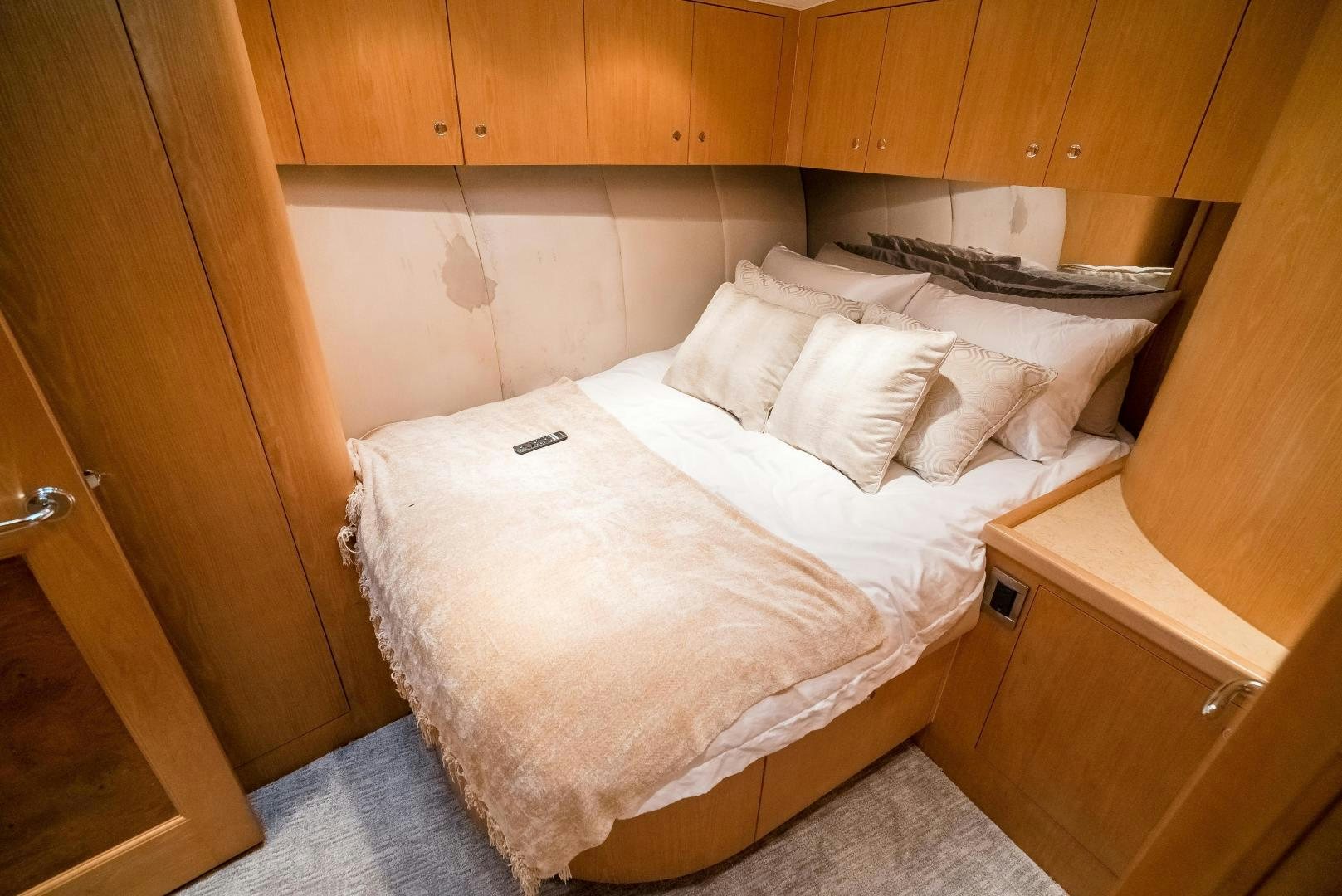 a bed with white sheets aboard CAPITAN MORGAN  Yacht for Sale
