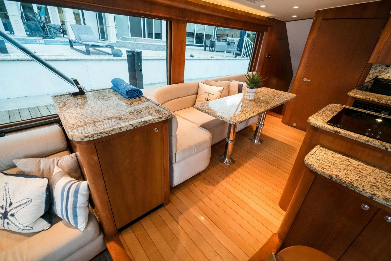 a living room with a couch and a table aboard CAPITAN MORGAN  Yacht for Sale