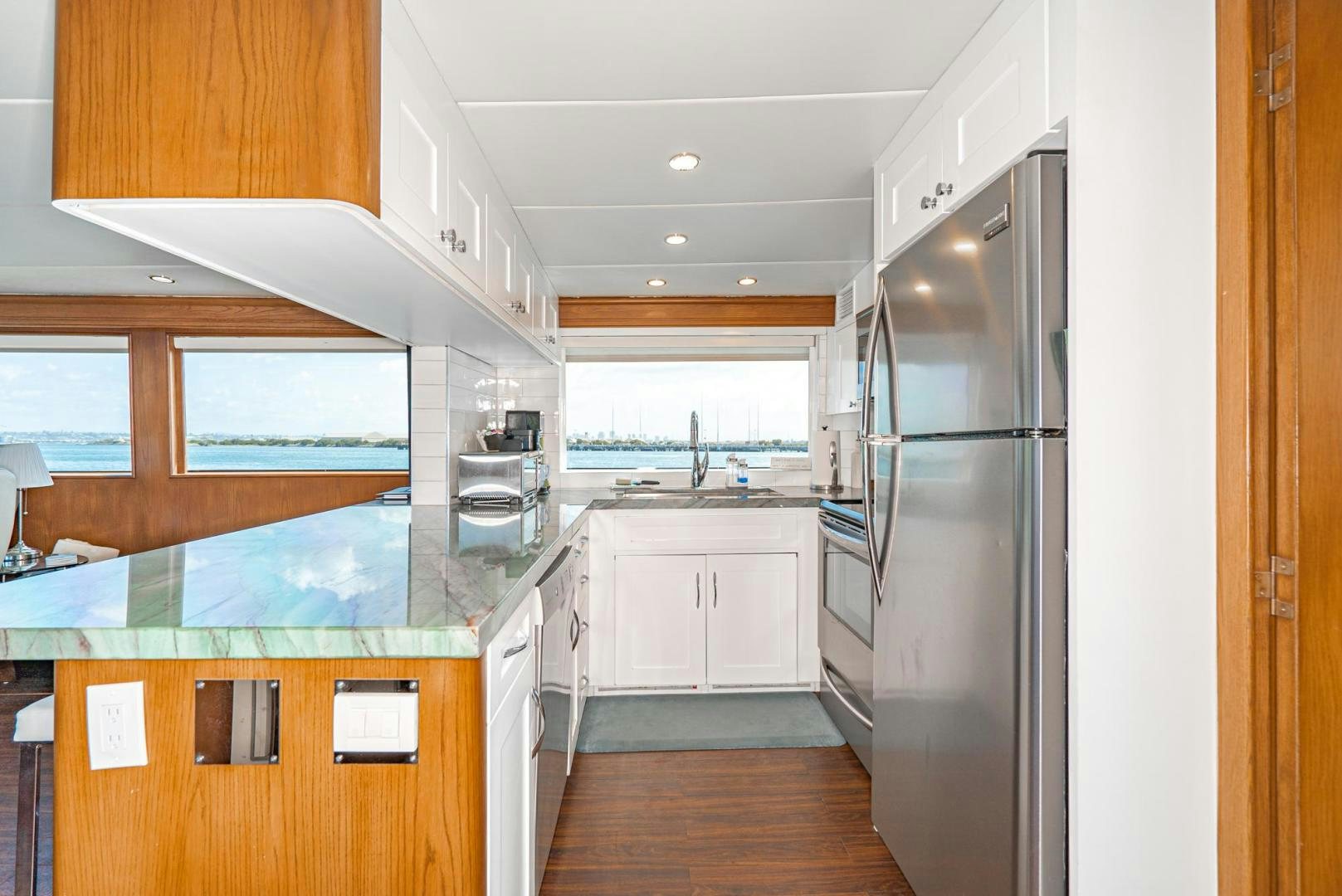 a kitchen with a large island aboard IMAGINE Yacht for Sale