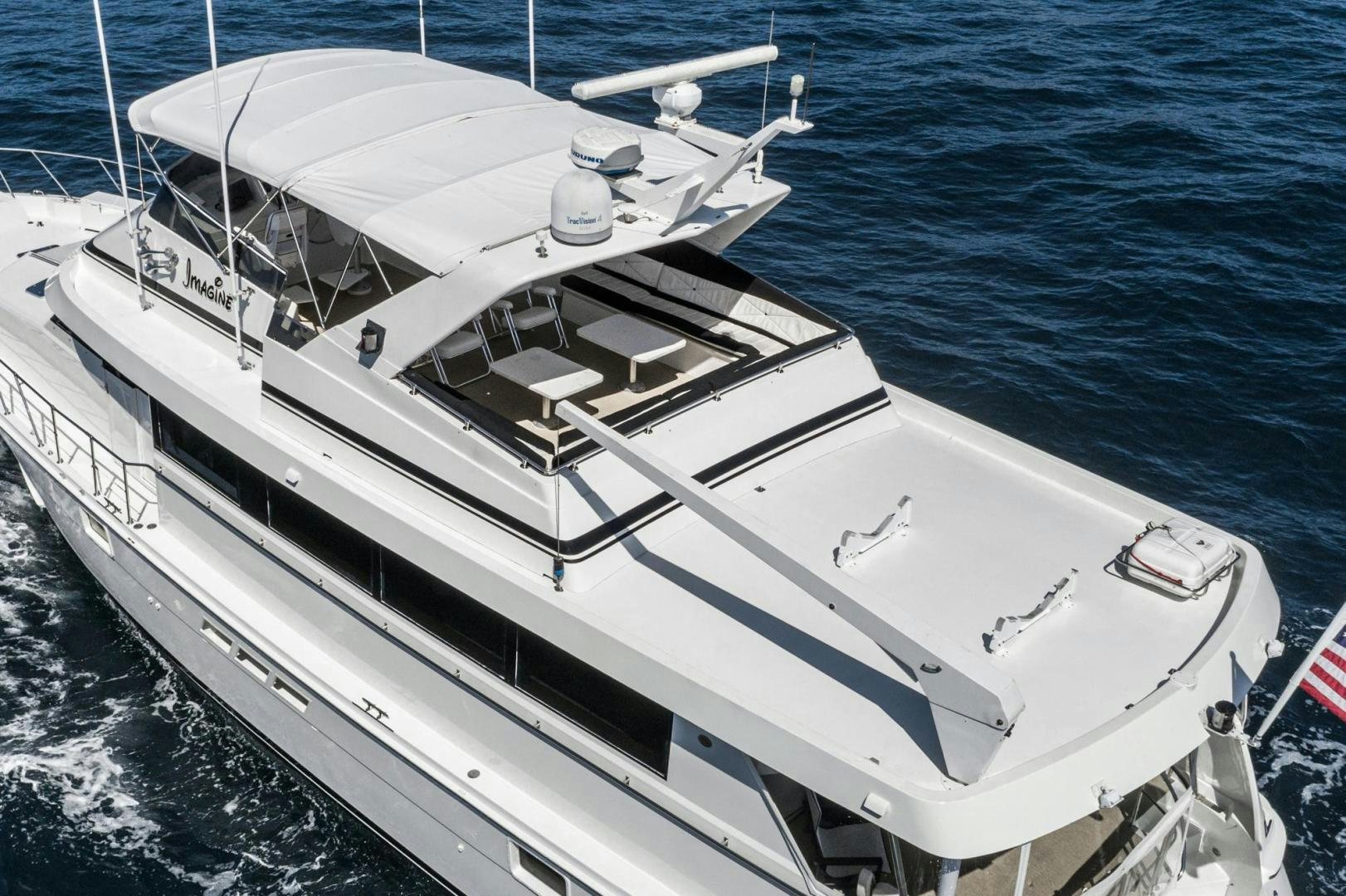 a white yacht in the water aboard IMAGINE Yacht for Sale