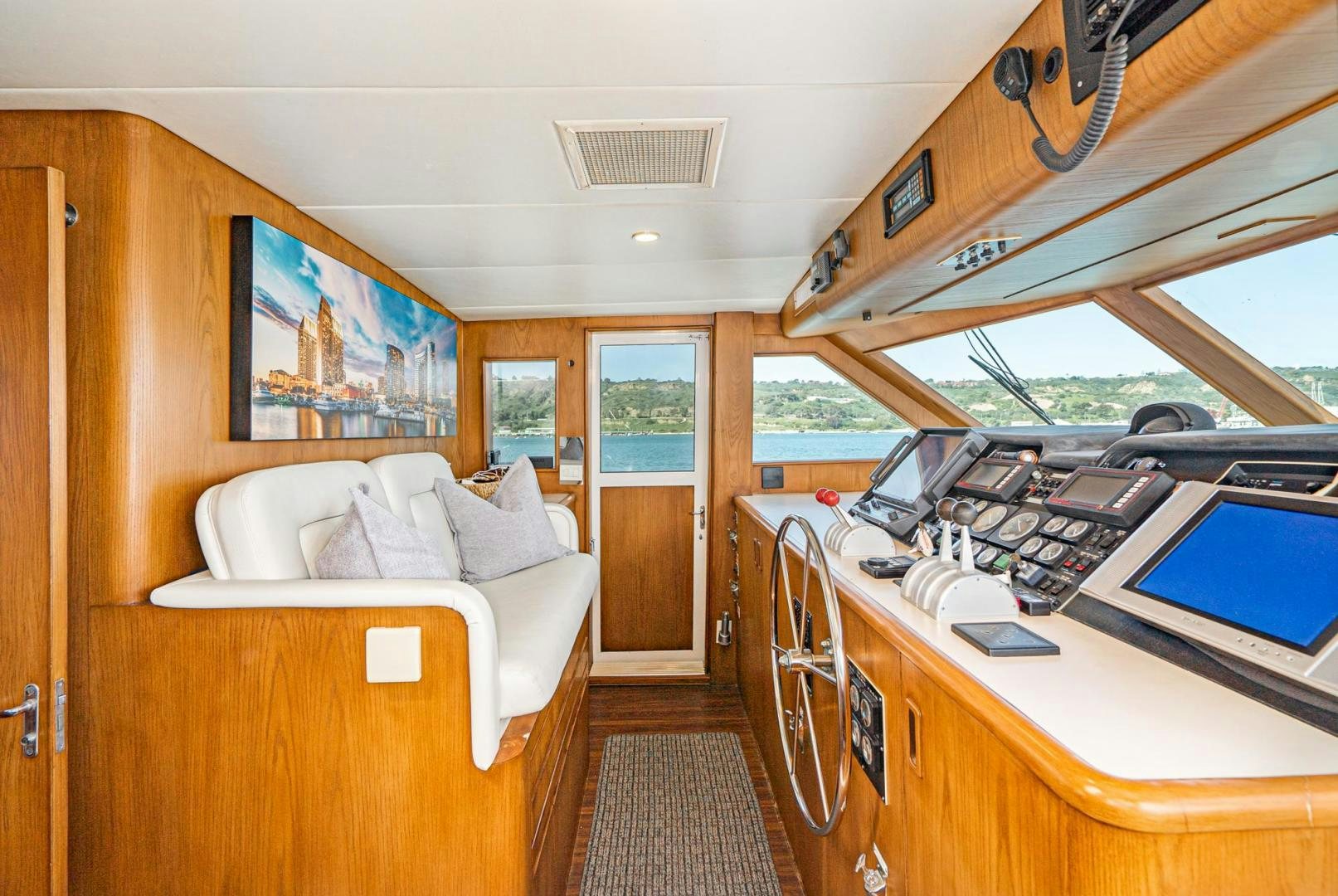 a bedroom with a bed and a desk aboard IMAGINE Yacht for Sale