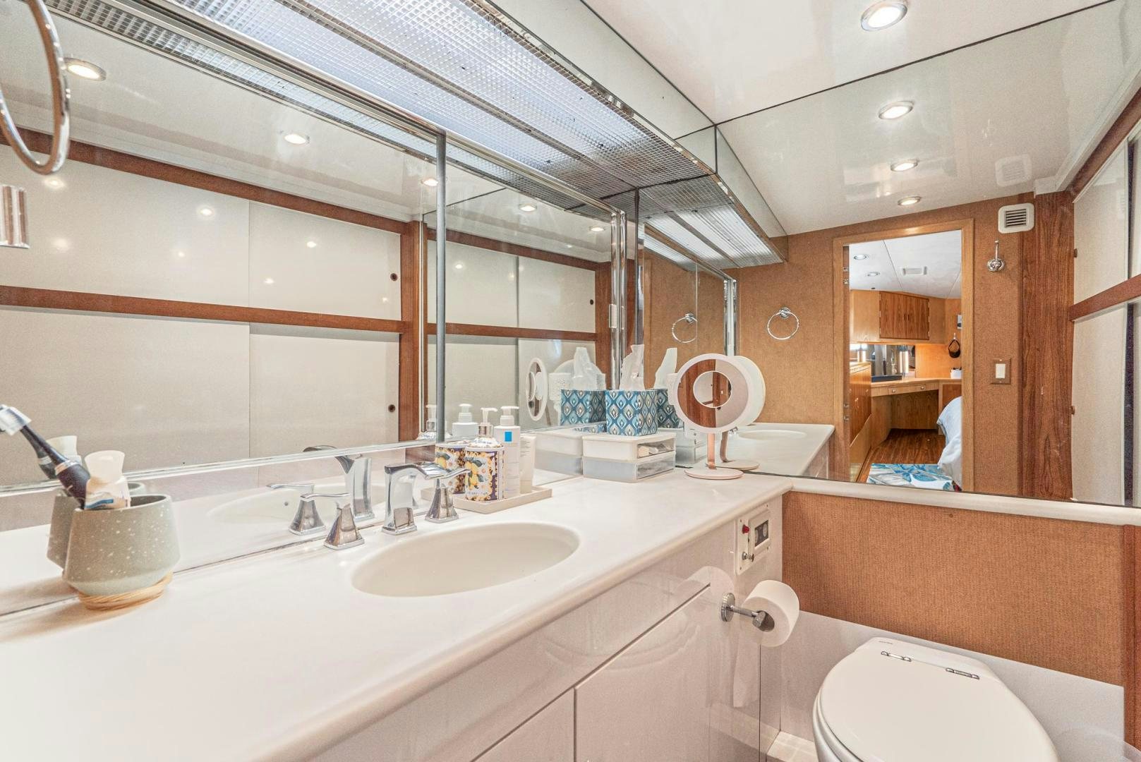 a bathroom with a large mirror aboard IMAGINE Yacht for Sale