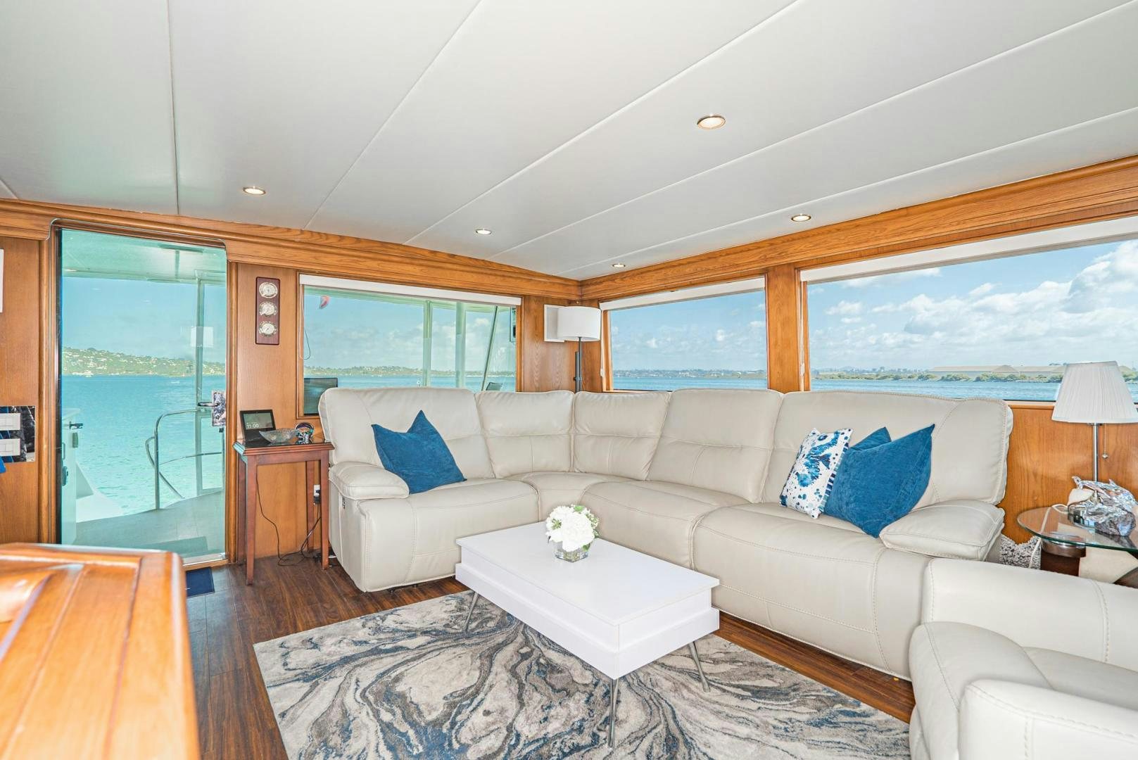 a living room with a large window aboard IMAGINE Yacht for Sale