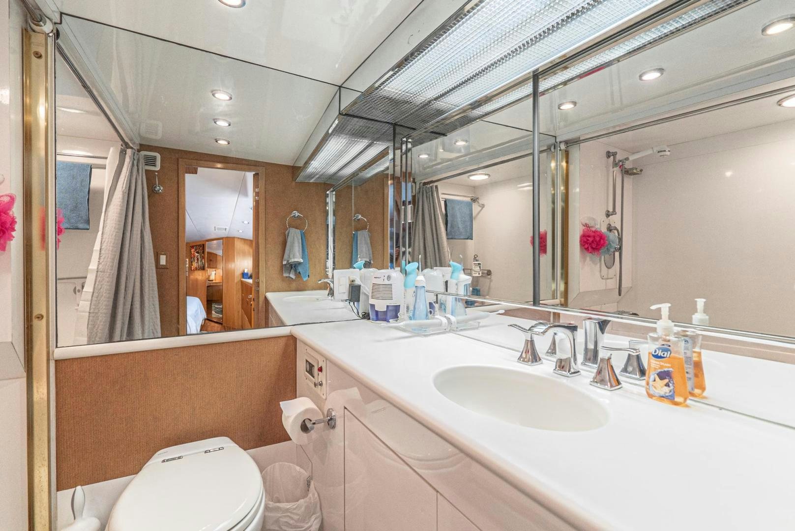 a bathroom with a large mirror aboard IMAGINE Yacht for Sale