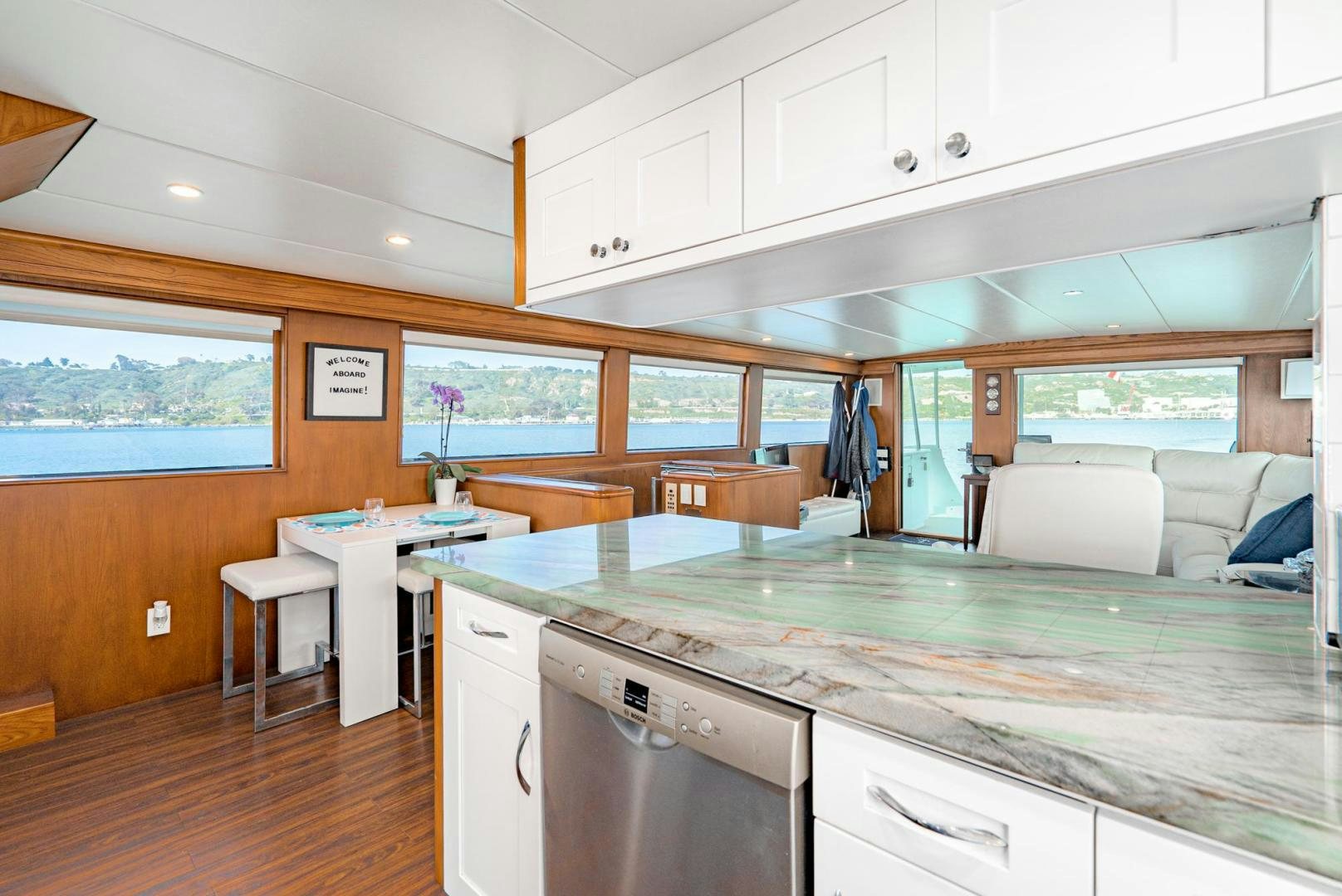 a kitchen with a large island aboard IMAGINE Yacht for Sale